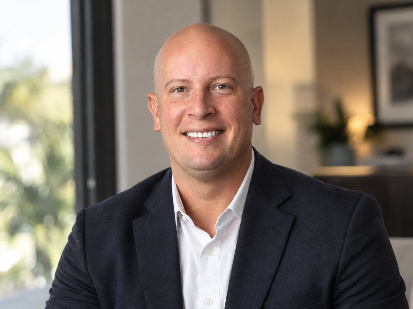 Stephen Resendes, REALTOR®, smiling in a navy blazer and white shirt